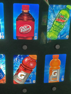 a group of soda bottles on a wall