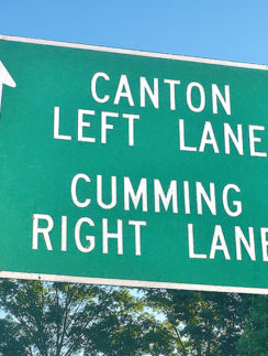 a green sign with white text