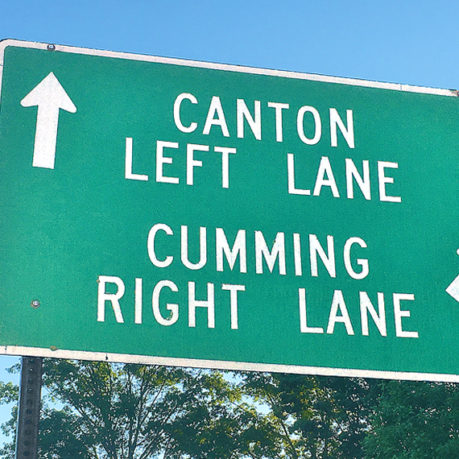 a green sign with white text