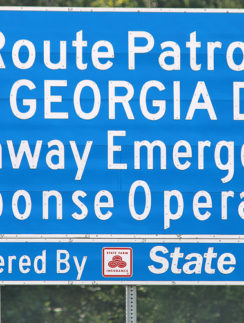 a blue sign with white text