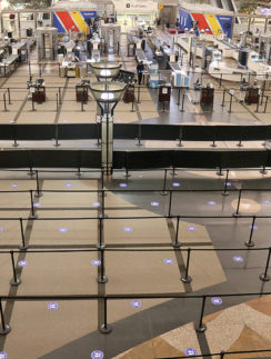 an airport terminal with check-in counters