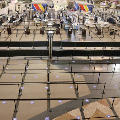 an airport terminal with check-in counters