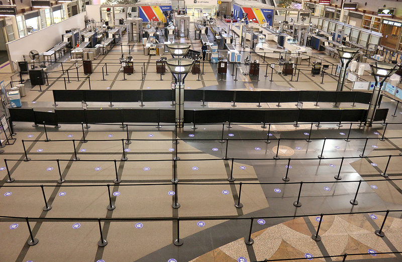 an airport terminal with check-in counters