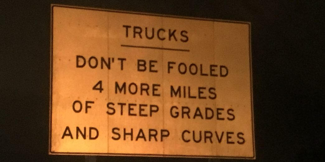 a sign with black text on it