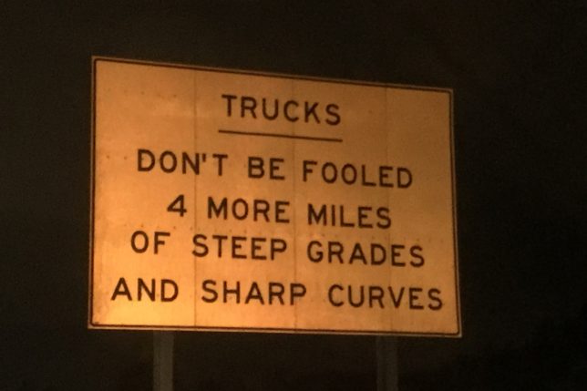 a sign with black text on it