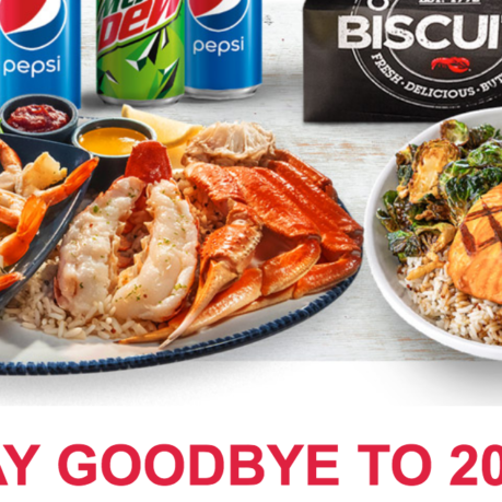 a plate of seafood and a can of soda