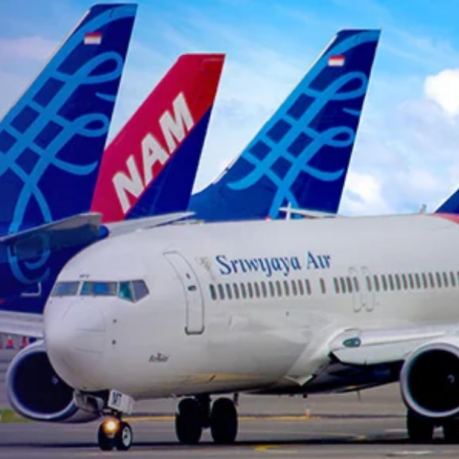 a group of airplanes on the runway