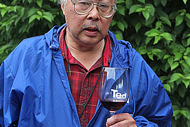 a man holding a wine glass