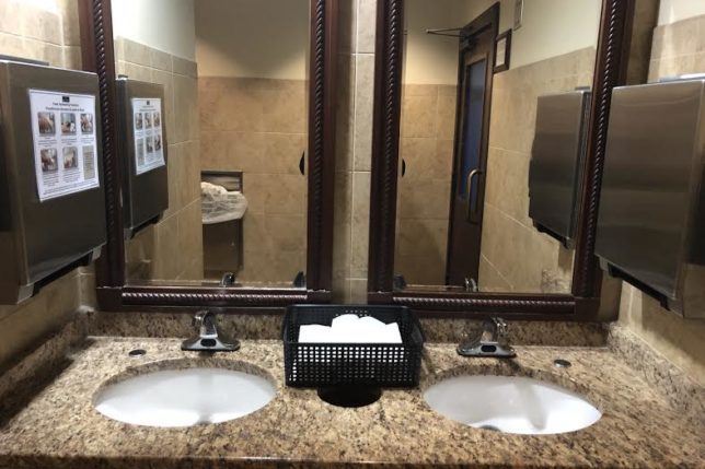 a bathroom with sinks and mirrors