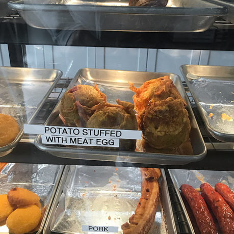 a trays of food on a shelf