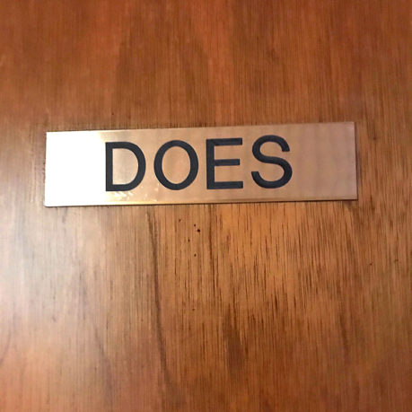 a sign on a wooden door