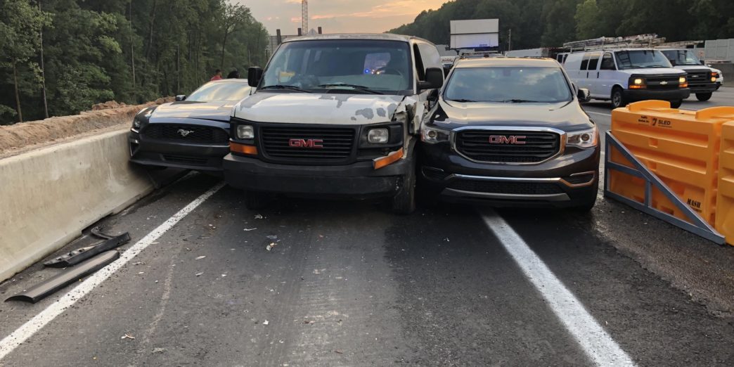 a group of cars on a road