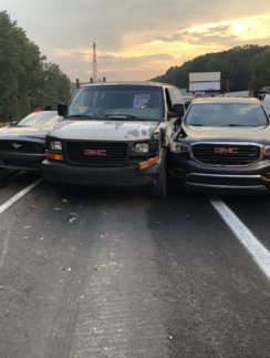 a group of cars on a road