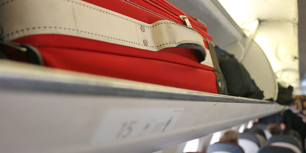 Overhead storage compartment bin