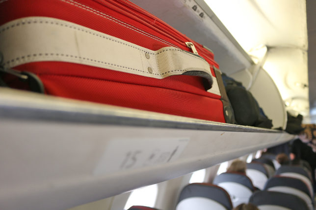 Overhead storage compartment bin