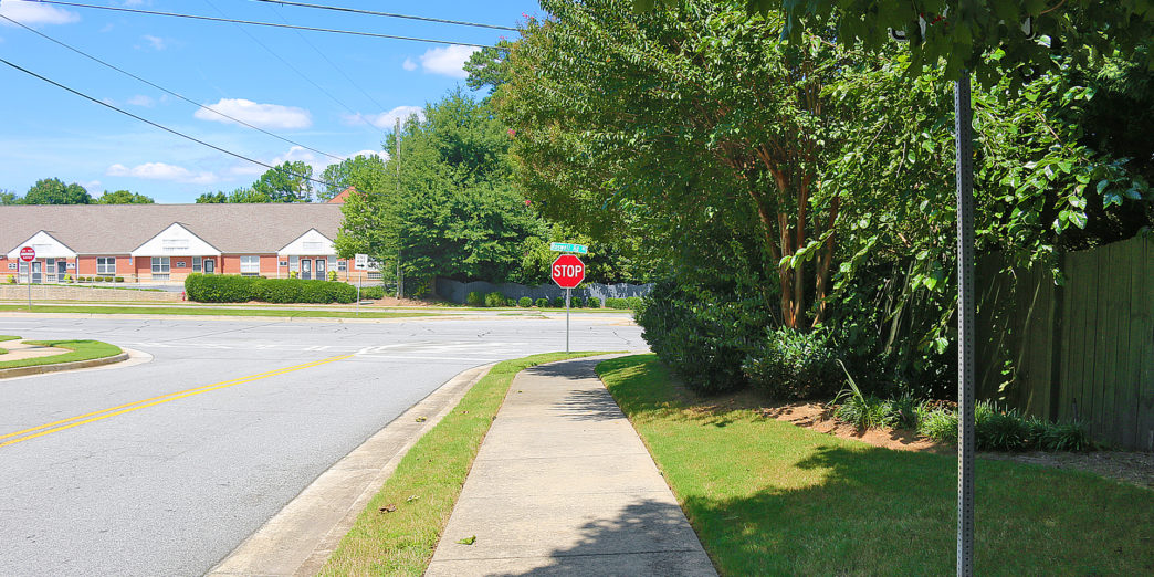 a stop sign on the side of a road