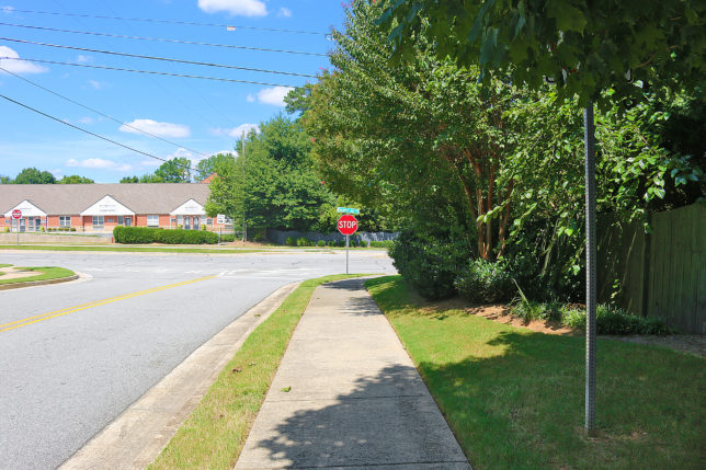 a stop sign on the side of a road
