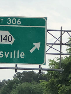 a green sign with white text