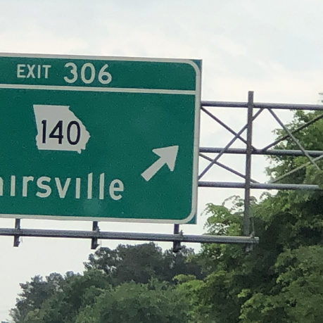 a green sign with white text