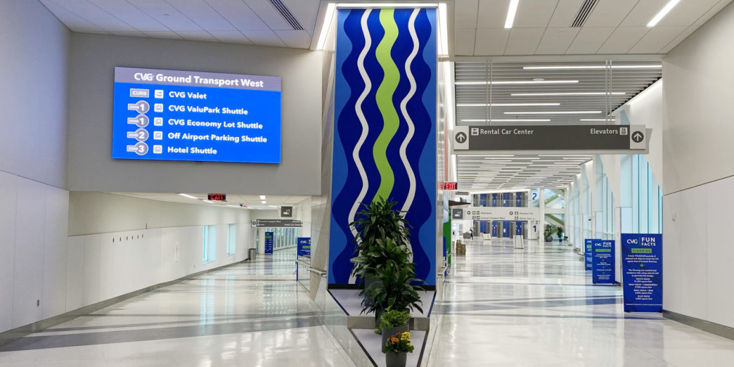 a blue and green sign in a building