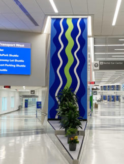 a blue and green sign in a building