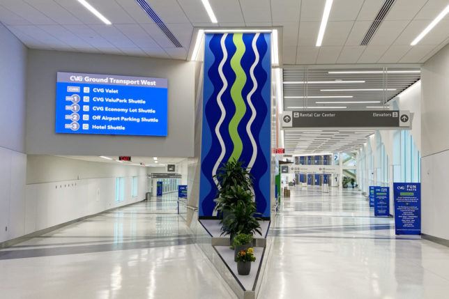 a blue and green sign in a building