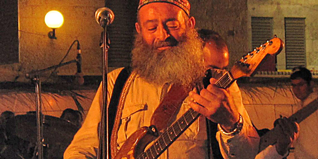 a man playing a guitar