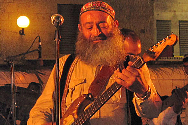 a man playing a guitar