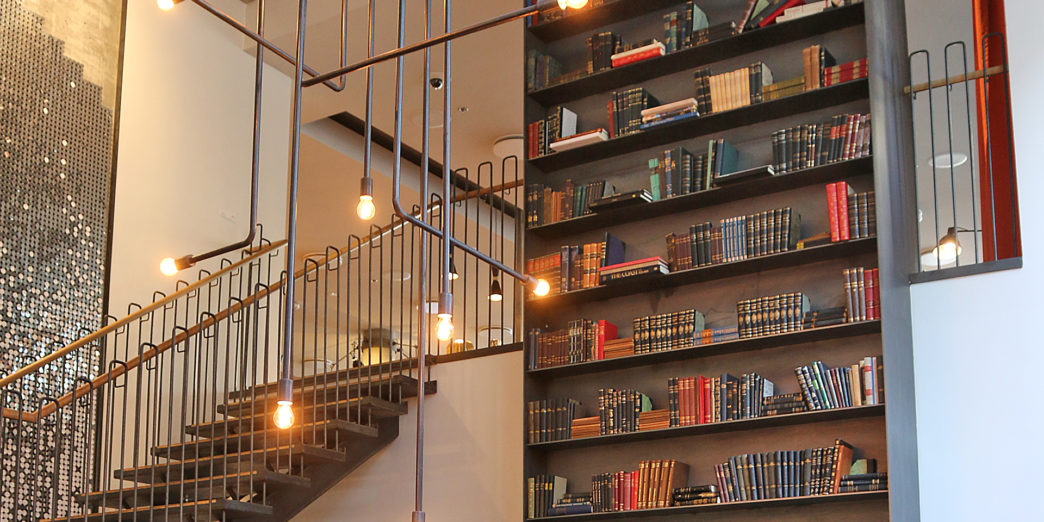 a staircase with books on shelves