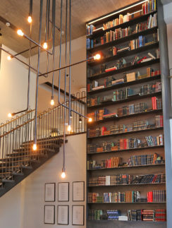 a staircase with books on shelves