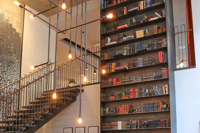 a staircase with books on shelves