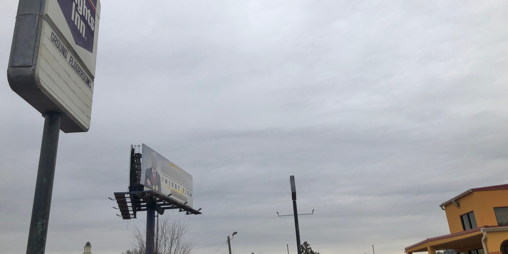 a billboard on a pole