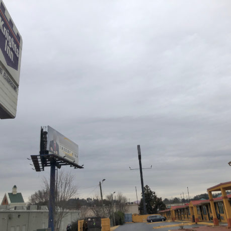 a billboard on a pole