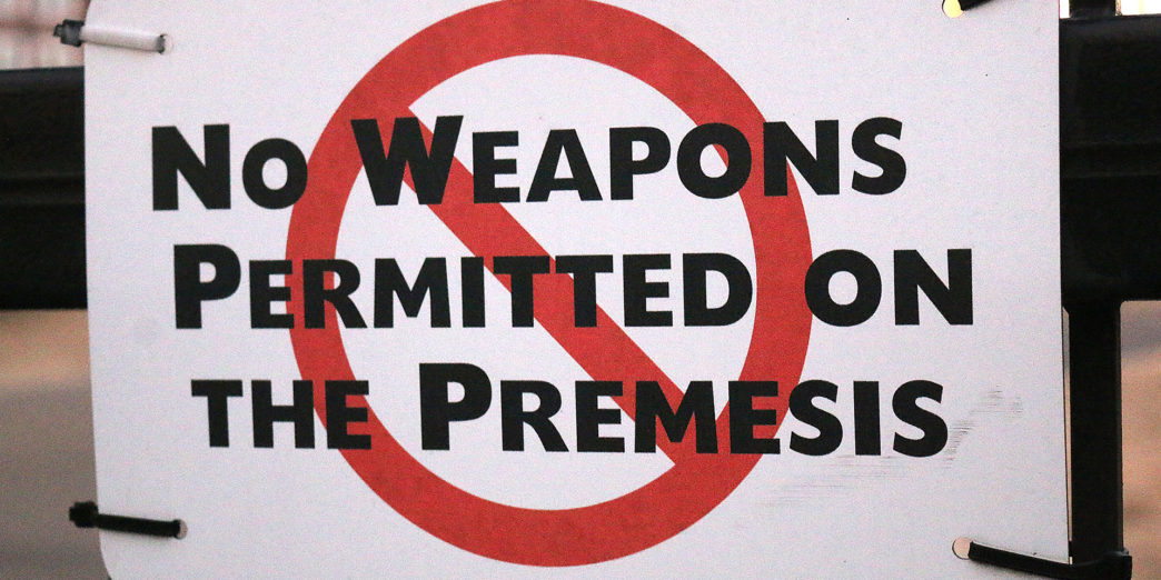 a sign with a red circle and black text