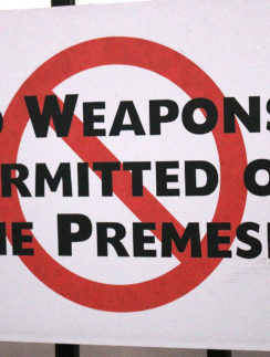 a sign with a red circle and black text