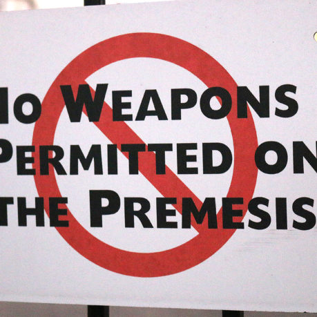 a sign with a red circle and black text