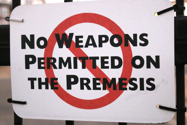 a sign with a red circle and black text