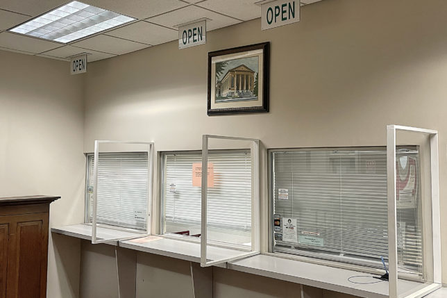 a row of empty white counters with closed windows