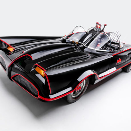 a black and red car with a red stripe