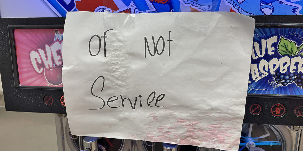 a paper sign on a machine