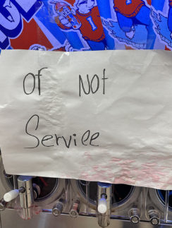 a paper sign on a machine