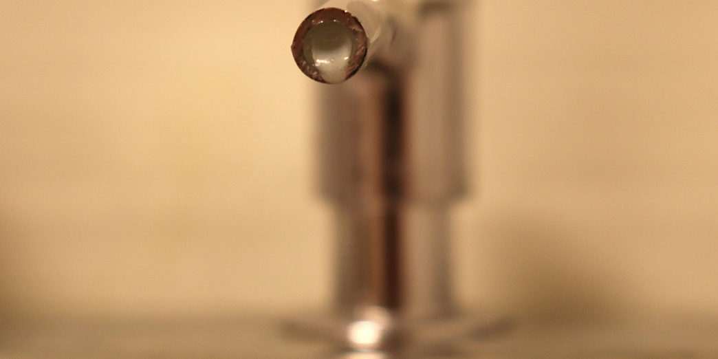 Bulk dispenser nozzle