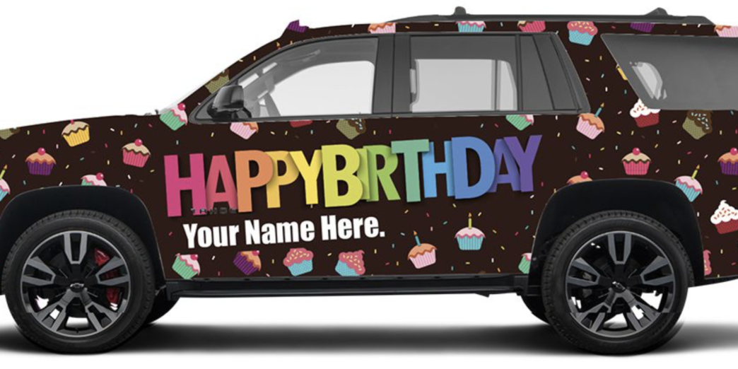 a car with a birthday sign