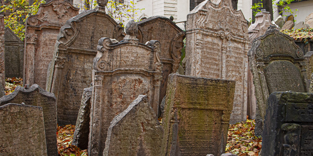 a group of tombstones in a cemetery