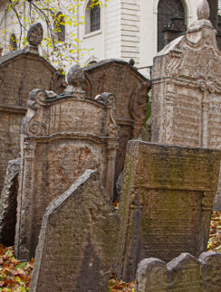 a group of tombstones in a cemetery