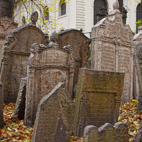 a group of tombstones in a cemetery