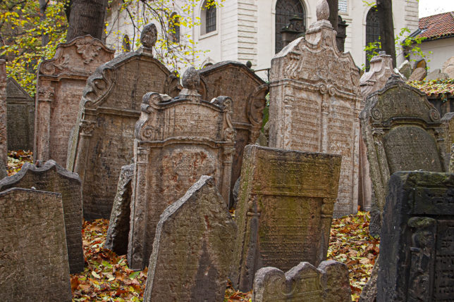 a group of tombstones in a cemetery