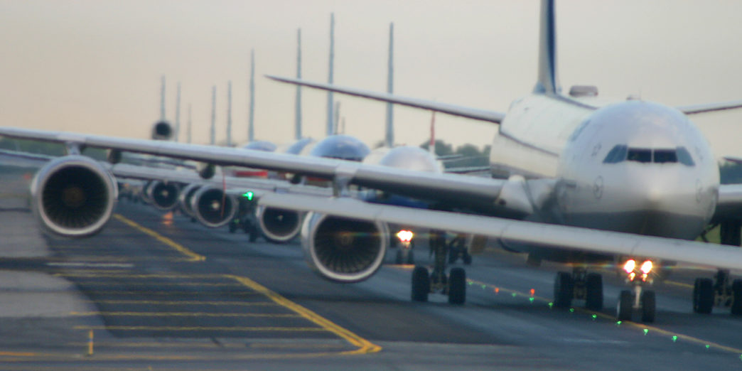 Airplanes lined up on runway