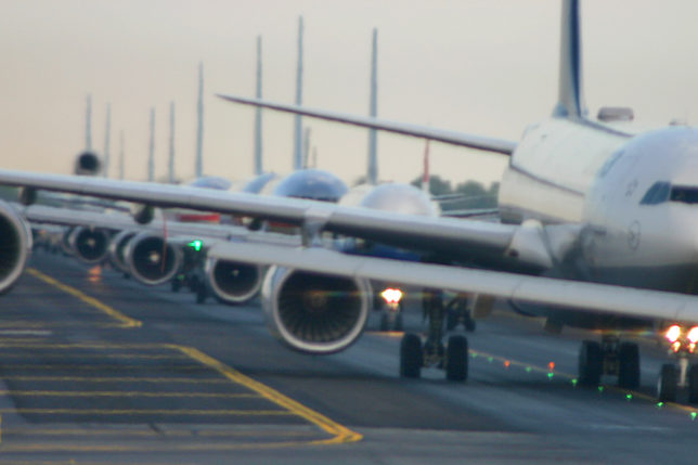 Airplanes lined up on runway