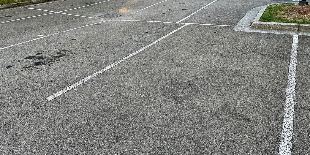 a parking lot with white lines